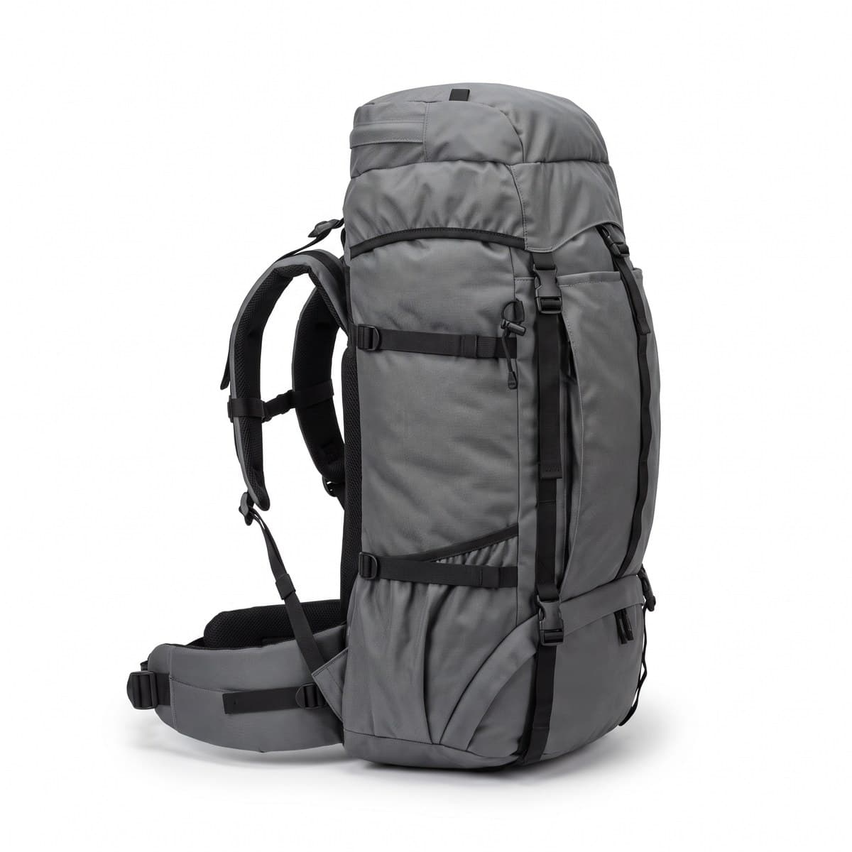 A grey internal-frame backpacking pack with black straps, a top lid, a padded hip belt and side compression straps, standing upright